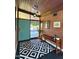 Entryway featuring a patterned rug, unique light fixture, and mid-century modern accents at 712 W Vernon Ave, Phoenix, AZ 85007