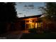 Charming single-story home with a flat roof, brick accents, and a well-lit covered porch at 712 W Vernon Ave, Phoenix, AZ 85007