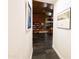 Entry hallway leading to dining and living area with slate flooring and artwork on the walls at 712 W Vernon Ave, Phoenix, AZ 85007