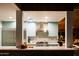 Kitchen with stainless steel appliances, custom blue cabinets, stone countertops and a breakfast bar at 712 W Vernon Ave, Phoenix, AZ 85007