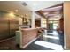 Bright kitchen with modern appliances, breakfast bar, light-blue cabinetry, skylight and open floor plan at 712 W Vernon Ave, Phoenix, AZ 85007