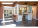 Stylish open kitchen boasts stainless appliances, light blue cabinets, skylights, and bar seating at 712 W Vernon Ave, Phoenix, AZ 85007