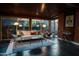 Stylish living room featuring exposed brick, wood ceilings, and bright, retro decor at 712 W Vernon Ave, Phoenix, AZ 85007