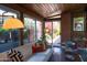 Bright living room with wood-paneled ceiling, modern decor, and large windows overlooking lush landscaping at 712 W Vernon Ave, Phoenix, AZ 85007