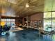 Airy living room showcases brick accent wall, an open layout, tiled floors, and inviting natural lighting at 712 W Vernon Ave, Phoenix, AZ 85007