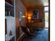Cozy living room area with brick wall, mid-century modern furniture, and natural light at 712 W Vernon Ave, Phoenix, AZ 85007