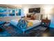 Bedroom featuring a king bed with stylish decor and views of the green backyard at 712 W Vernon Ave, Phoenix, AZ 85007