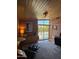 Office space featuring brick wall, wood ceiling and sliding glass door to the pool area at 712 W Vernon Ave, Phoenix, AZ 85007