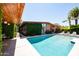 Inviting pool with lush greenery, palm trees, and lounge chairs perfect for relaxation at 712 W Vernon Ave, Phoenix, AZ 85007