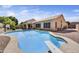 Spacious backyard showcasing a diving pool, patio area, and exterior house view at 7332 W Pershing Ave, Peoria, AZ 85381
