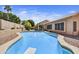 Beautiful backyard with a diving pool, grassy area, and covered patio space at 7332 W Pershing Ave, Peoria, AZ 85381