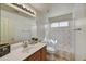 Clean bathroom featuring a single sink vanity, shower, and natural lighting at 7332 W Pershing Ave, Peoria, AZ 85381