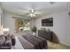 Inviting bedroom features ample natural light and modern furnishings for a comfortable and stylish retreat at 7332 W Pershing Ave, Peoria, AZ 85381