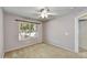 Neutral bedroom with carpet, a ceiling fan, and a window at 7332 W Pershing Ave, Peoria, AZ 85381