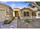 Inviting single-story home exterior with desert landscaping and a covered entrance, offering curb appeal at 7332 W Pershing Ave, Peoria, AZ 85381