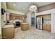 Open kitchen featuring an island, stainless steel appliances, and tile flooring at 7332 W Pershing Ave, Peoria, AZ 85381
