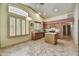 Bright and airy kitchen with an island, stainless steel appliances, and shuttered windows at 7332 W Pershing Ave, Peoria, AZ 85381