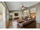 Spacious living room featuring comfortable leather seating, and an open layout, great for gatherings at 7332 W Pershing Ave, Peoria, AZ 85381