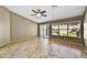 Open living room featuring tile floors, large windows, and access to the backyard at 7332 W Pershing Ave, Peoria, AZ 85381