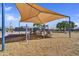 Fun playground area with a sunshade, slides, and climbing structures in the community park at 7332 W Pershing Ave, Peoria, AZ 85381