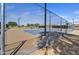 Fenced tennis court with benches at a community park, perfect for sports and recreation at 7332 W Pershing Ave, Peoria, AZ 85381