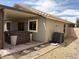 Exterior view of backyard featuring a covered patio with hot tub and air conditioning unit at 7415 S 16Th S Dr, Phoenix, AZ 85041