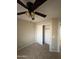Bedroom featuring neutral walls, carpet, ceiling fan, and closet with an open door at 7415 S 16Th S Dr, Phoenix, AZ 85041