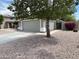Street view of a lovely single-story home featuring a driveway and desert landscaping at 7415 S 16Th S Dr, Phoenix, AZ 85041