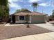 Charming single-story home with a well-maintained front yard and a two-car garage at 7415 S 16Th S Dr, Phoenix, AZ 85041