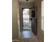 Inviting foyer with a security screen and tile flooring, showcasing a welcoming entrance at 7415 S 16Th S Dr, Phoenix, AZ 85041