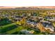 Expansive aerial view of homes surrounding a lush golf course and community lakes at 7425 E Gainey Ranch Rd # 13, Scottsdale, AZ 85258