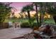 Private patio area surrounded by mature trees and professional landscaping and golf course views at 7425 E Gainey Ranch Rd # 13, Scottsdale, AZ 85258