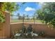 Beautiful backyard view with a statue on a bench overlooking the golf course at 7425 E Gainey Ranch Rd # 13, Scottsdale, AZ 85258