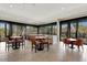 Bright clubhouse with comfortable seating, a bar, and large windows showcasing the lush landscape at 7425 E Gainey Ranch Rd # 13, Scottsdale, AZ 85258