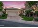 Charming single-story home featuring a neutral color palette, desert landscaping, and a spacious two-car garage at 7425 E Gainey Ranch Rd # 13, Scottsdale, AZ 85258