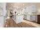 Open kitchen with white cabinets, marble counter tops, and stainless steel appliances at 7425 E Gainey Ranch Rd # 13, Scottsdale, AZ 85258