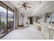 Luxurious bathroom featuring a soaking tub with mountain views, and vanity with a large mirror at 7816 N 47Th St, Paradise Valley, AZ 85253