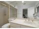 Well-lit bathroom featuring a vanity, toilet, and a glass-enclosed shower at 7816 N 47Th St, Paradise Valley, AZ 85253