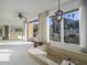 Bright bathroom features a soaking tub with exterior views and a hanging light fixture at 7816 N 47Th St, Paradise Valley, AZ 85253