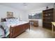 Bright bedroom featuring a bed, desk, bookshelf, and window at 7816 N 47Th St, Paradise Valley, AZ 85253