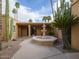 Charming courtyard featuring a decorative fountain surrounded by mature cactus landscaping at 7816 N 47Th St, Paradise Valley, AZ 85253