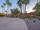 Beautiful home exterior with desert landscaping and a circular driveway with mountain views at dusk at 7816 N 47Th St, Paradise Valley, AZ 85253