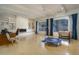 Spacious game room with fireplace, built-in shelves, pool view, and fun activities at 7816 N 47Th St, Paradise Valley, AZ 85253