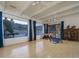 Large game room with ample natural light, pool view, and a variety of entertainment options at 7816 N 47Th St, Paradise Valley, AZ 85253