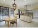 Bright kitchen features stainless steel appliances, large island, and sliding door to pool area at 7816 N 47Th St, Paradise Valley, AZ 85253