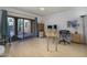 Bright office space features hardwood floors, a ceiling fan, and sliding glass doors that lead to a private outdoor patio at 7816 N 47Th St, Paradise Valley, AZ 85253