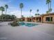 Backyard pool with desert landscaping, patio, and beautiful architecture, perfect for outdoor living at 7816 N 47Th St, Paradise Valley, AZ 85253