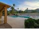 Backyard pool with spa, mature landscaping, and patio, creating a private oasis for relaxation and entertainment at 7816 N 47Th St, Paradise Valley, AZ 85253
