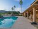 Inviting backyard pool with covered patio, mountain views, and ample space for relaxation at 7816 N 47Th St, Paradise Valley, AZ 85253