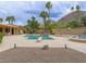 Inviting backyard with sparkling pool, lush landscaping, and mountain views create a perfect outdoor oasis for relaxation and enjoyment at 7816 N 47Th St, Paradise Valley, AZ 85253